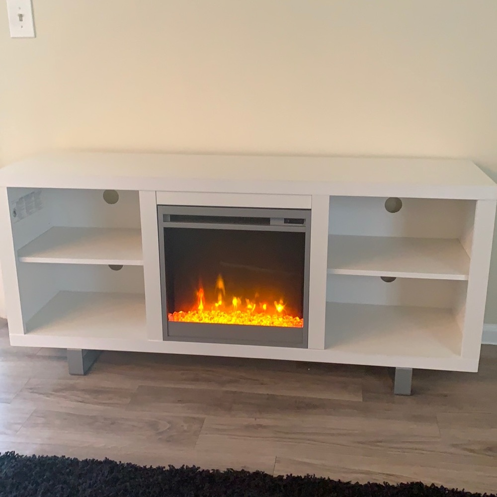 White tv stand with four shelf Ann fire place